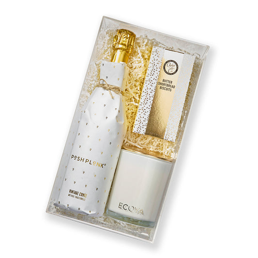 Opulent gift hamper with sparkling wine, gourmet shortbread, and a scented candle from Gift Republiq.