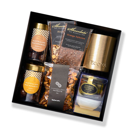 Premium hamper with antipasto, chocolate blocks, caramelised peanuts, Ecoya candle, and Koko Black treats.