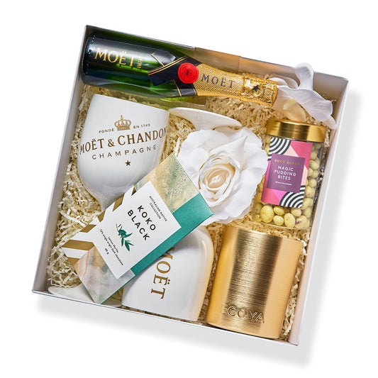 C’est La Vie hamper with Moët Brut, goblets, Ecoya candle, Koko Black treats, and rose from Gift Republiq.
